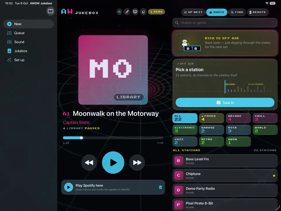 The Arcade WOW Jukebox app on iPad: the record deck beside the radio panel with every station by genre